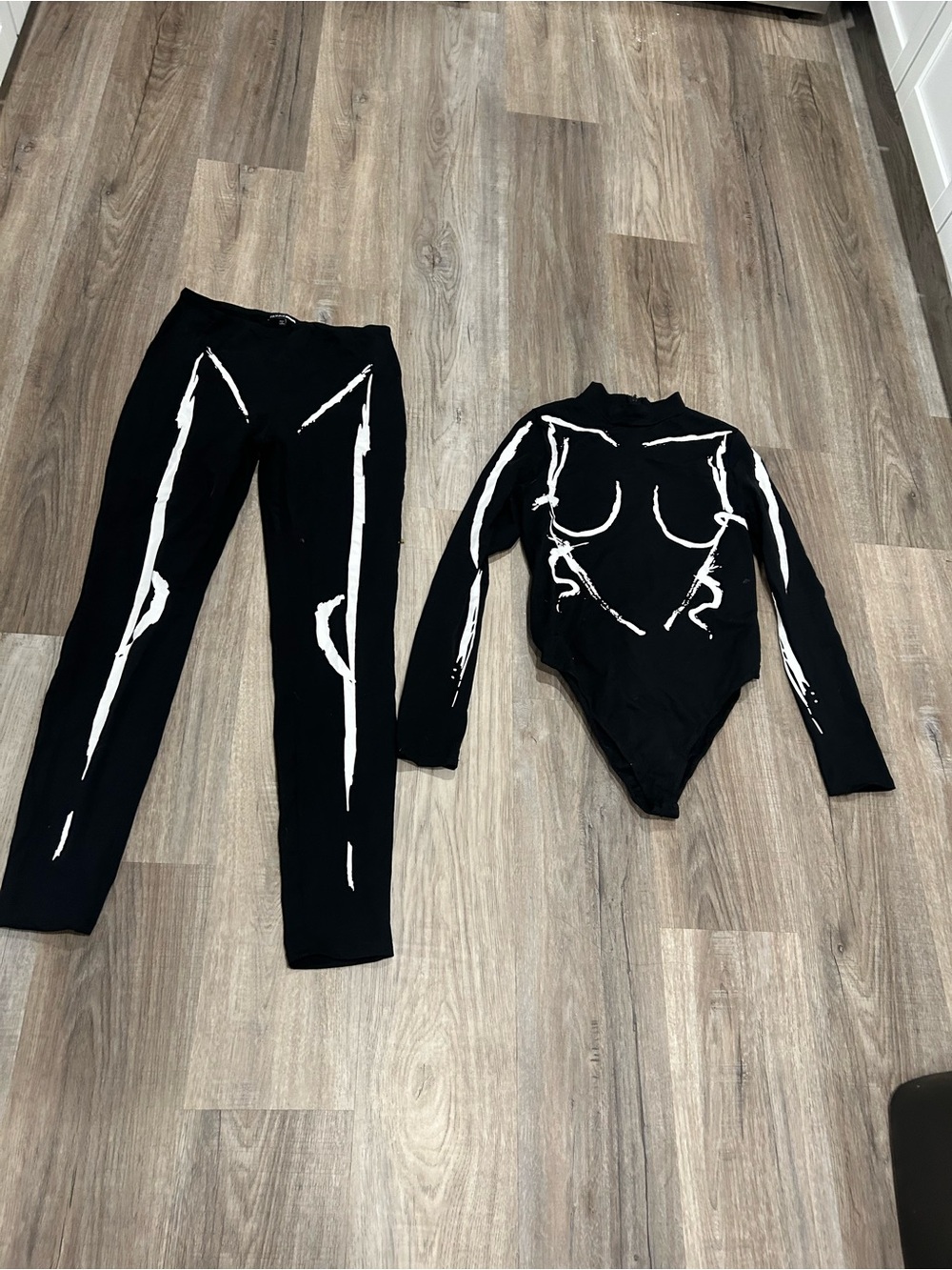 Fashion Nova Black Bodysuit & Leggings Set with White Abstract Accents